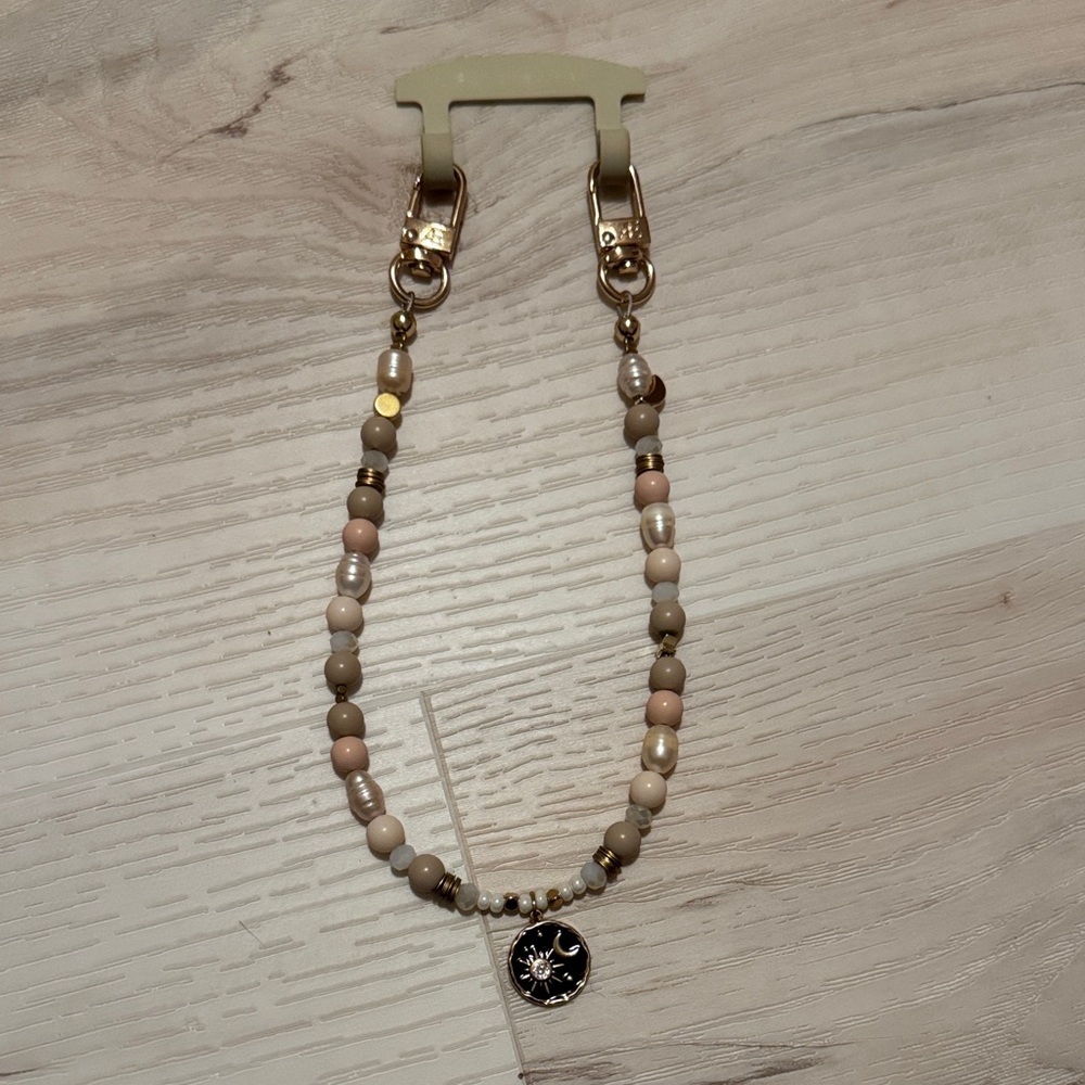 The CAEP beaded phone wristlet